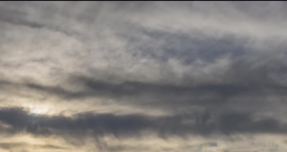 Timelapse of Evening Sun Rays Emerging Through the Cold Foggy Clouds in the Mountains. Sunset in