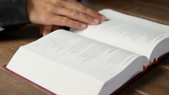 Blind woman reading a braille book