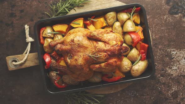 Delicious Whole Chicken Cooked with Pumpkin, Pepper and Potatoes. Served in Metal Baking Pan.