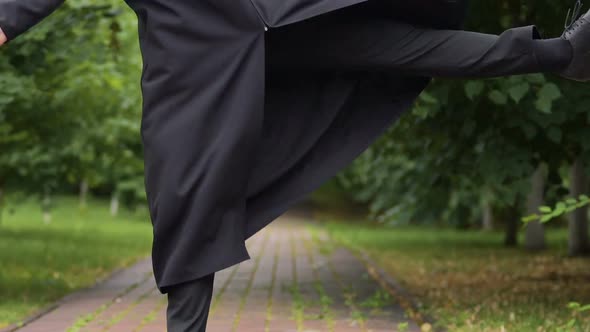 Happy Satisfied Male Graduate Jumping With Joy After Graduation, Achievement