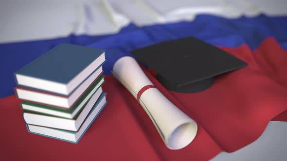 Graduation Cap and Diploma on the Russian Flag