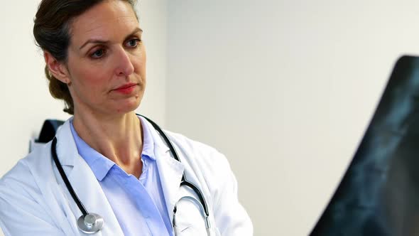 Female doctor examining an x-ray