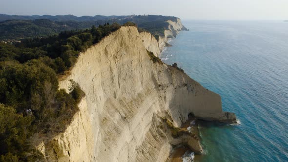 Drone Over Coastline Cliffs And Sea At Sunrise Of Cape Drastis