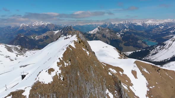 Aerial Drone View on Snowy Peaks of Swiss Alps. Switzerland. Rochers-de-Naye Mountain Peak