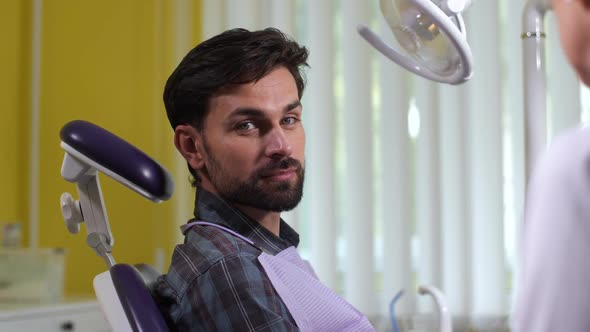 Portrait of Dentist's Patient Smiling at Camera