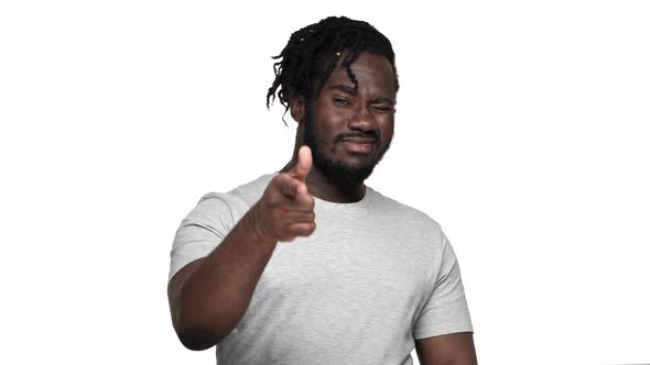 Portrait of Flirty Muscular African American Man Wearing Afro Hairdo and Mustache Gesturing at