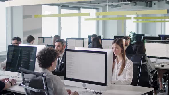 Modern Corporate Office Open Space With Multicultural Busy Staff Employees Group GUsing PC Computers