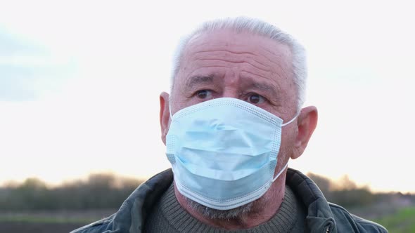 Close Up Portrait of a Senior Man in a Mask