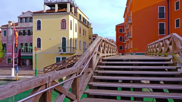 Empty Wooden Bridges Over Narrow Italian Channels in Morning