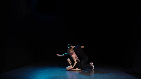 Romantic Choreography Against Black Background in Spotlight at Studio, Slow Motion.