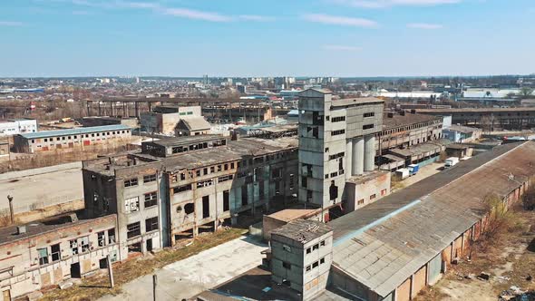 Abandoned building. Aerial view of an old factory ruin and broken windows.