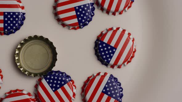 Rotating shot of bottle caps with the American flag printed on them - BOTTLE CAPS 003