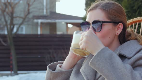 Woman With Coffee Talking On Phone