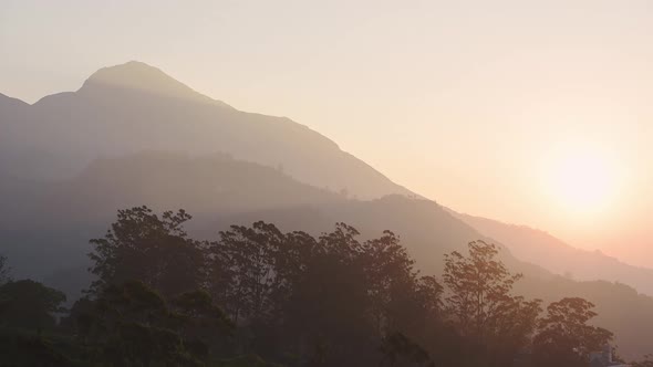 Landscape view of mountains and hills on a misty morning, in Munnar, India