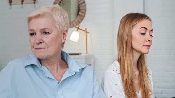 Upset Old Mother Feeling Sad After Conflict with Young Adult Daughter Avoid Talk Sit Turned Back on