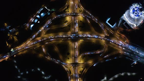 Night Aerial Urban Traffic Road System. Busy Downtown 