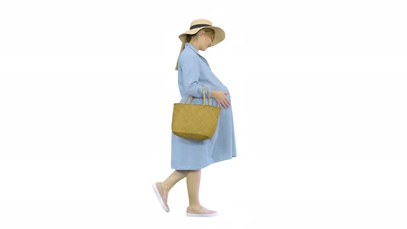 Beautiful Pregnant Woman Wearing Big Hat Walking and Touching Her Belly on White Background