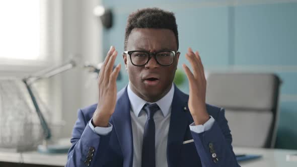 Portrait of Disappointed African Businessman Reacting to Loss