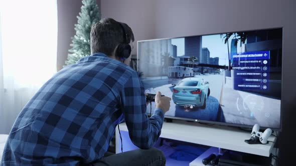 Man playing video games at home