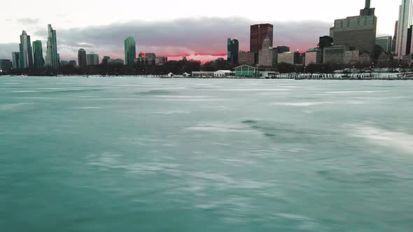 sunset chicago from drone perspective on lake michigan in chicago