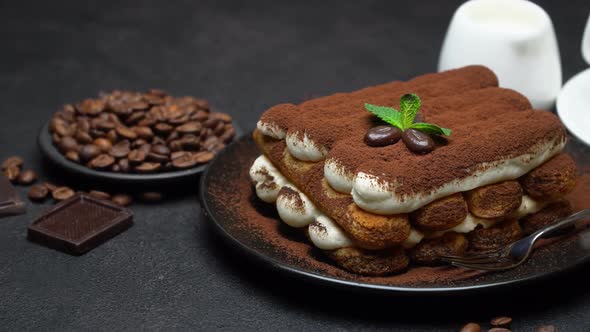 Classic Tiramisu Dessert, Cup of Coffee, Sugar and Milk on Concrete Background