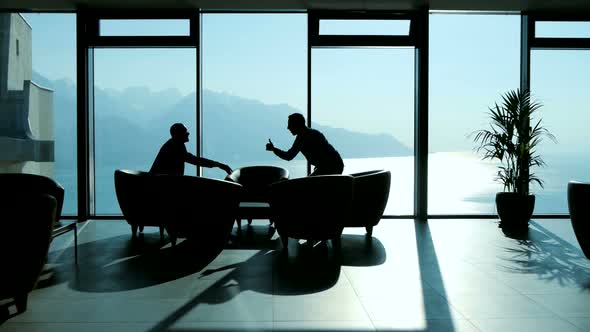 Business People Meeting in Modern Lobby Office Hall Talking Together about Financial Investment Deal