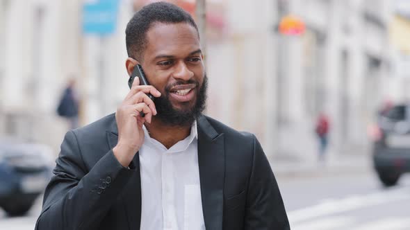 Closeup Smiling Millennial Bearded African American Entrepreneur Talk to Client on Phone Share