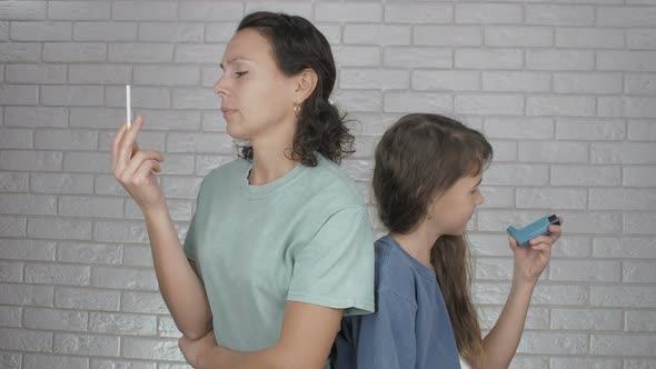 Smoking Mother. Woman Smokes with a Child.