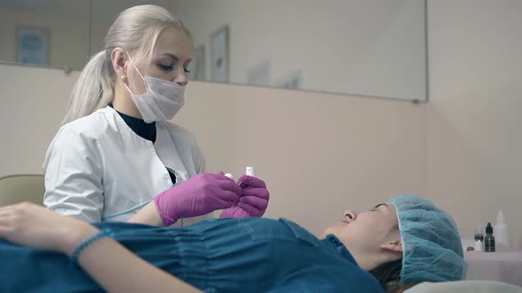 Master Shows Cosmetic Product To Client in Beauty Salon