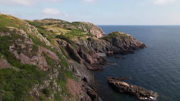 Flying forward, upwards to get nice view of cliffs and ocean at Kullaberg, Sweden