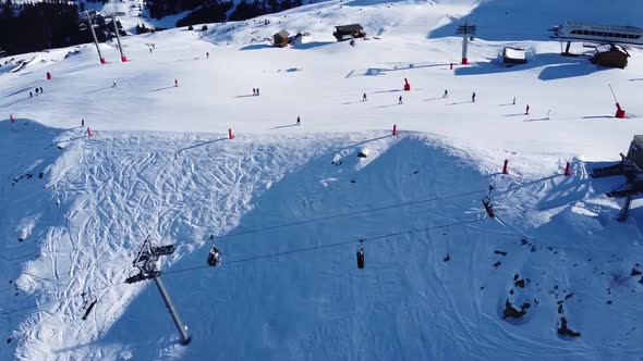 Aerial View of the Alps Mountains in France. Mountain Tops Covered in Snow. Alpine Ski Facilities