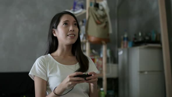 Woman playing TV game 