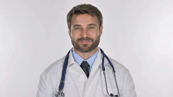 Tired Doctor Looking at Camera in Studio on White Background