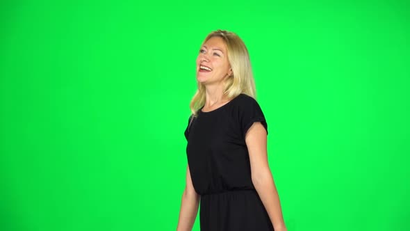 Girl Goes with Multicolored Paper Bags Enjoying Shopping. Chroma Key. Slow Motion