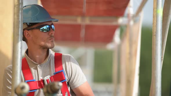 Worker on a Scaffolding. Work at Height. Construction Industry 