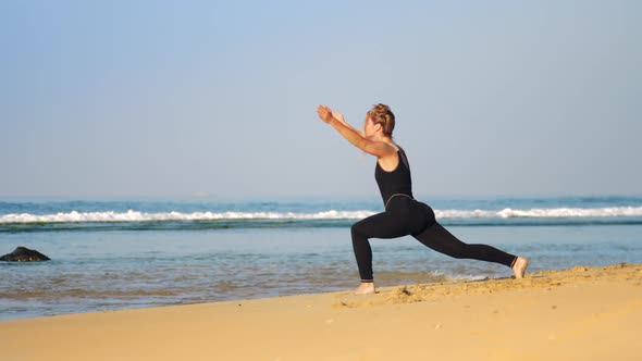 Woman with Space Buns Practices Yoga Pose Warrior