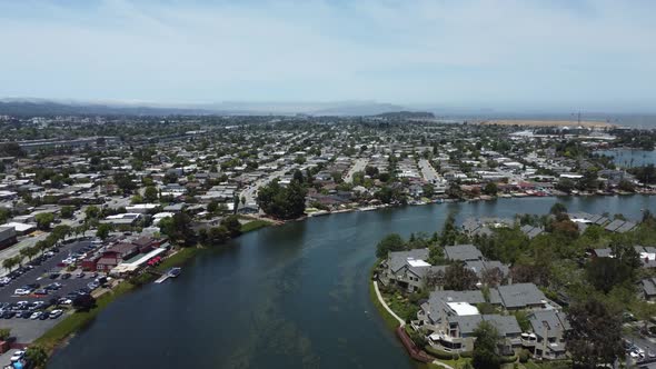 Drone Flying Over Blue Lagoon Path, Huge Number Of Villas On Both Sides, San Mateo