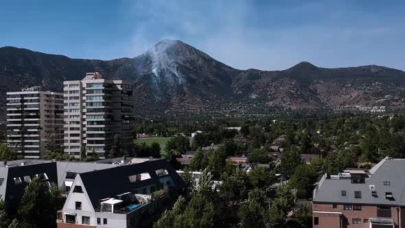 Pedestal shot of a fire in Manquehue hill Santiago