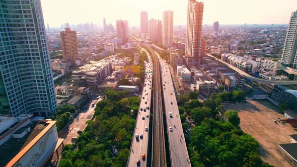 4K : Drones fly over the Chao Phraya River. Aerial view over bts skytrain