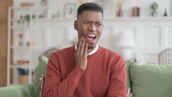 Portrait of Sick African Man having Toothache