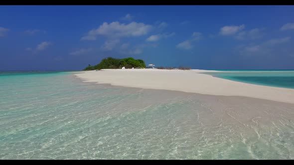 Aerial drone shot seascape of beautiful seashore beach holiday by blue ocean with white sandy backgr