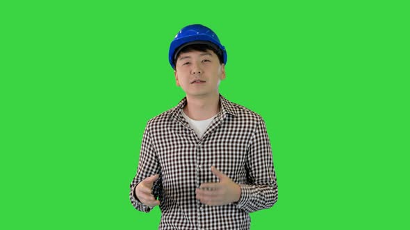 Construction Supervisor Walking and Talking on Camera on a Green Screen Chroma Key