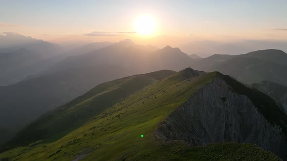 Aerial hikers in the Dolomites mountains at sunrise