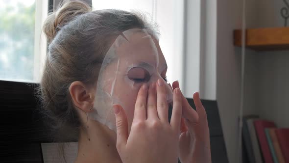 Young Woman Making Sheet Mask