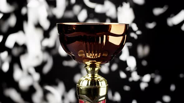 Golden Cup on Black Background Closeup