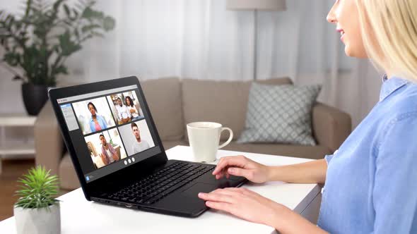 Woman Having Video Chat with Her Friends on Laptop