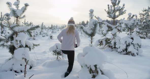 Woman Walking Hiking in Deep Snow in Winter in Nature Slow Motion Gimbal