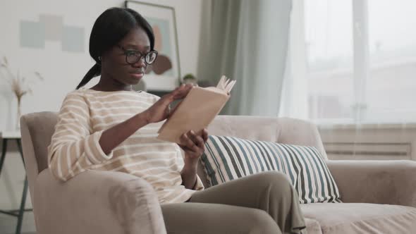 Young African Woman Reading Book