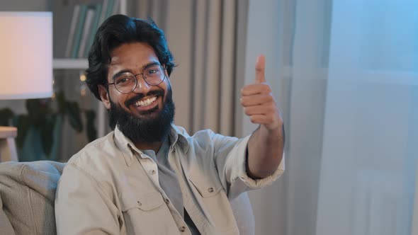 Portrait Happy Satisfied Joyful Arabic Indian Man Bearded Male in Glasses Sitting at Home in New