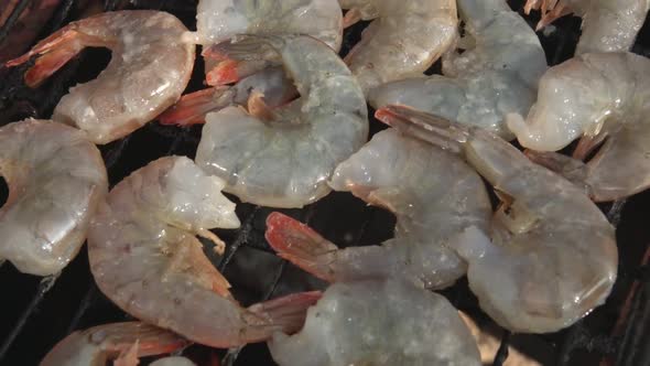 Top View Panorama of the Large Raw Shrimps Roasting on the Grill Grid